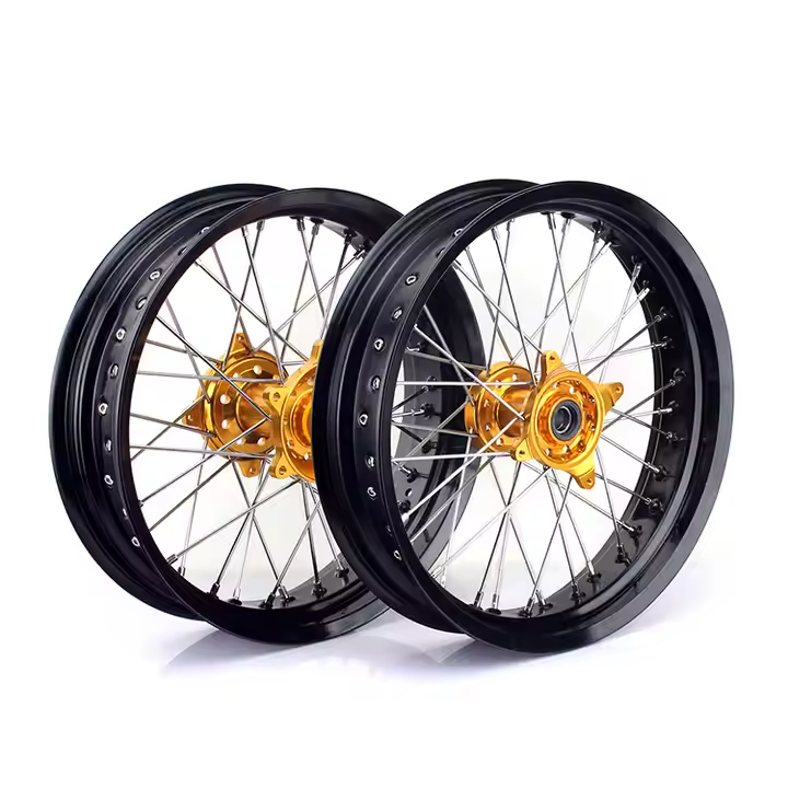 Gold hub custom laced motorcycle wheels with black rims and polished spokes, suitable for Suzuki cruisers or classic custom builds.