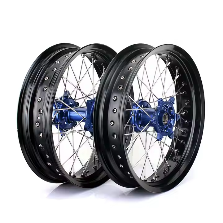 Blue anodized laced wheels with high-strength stainless spokes and black powder-coated rims, built for Suzuki adventure or scrambler motorcycles.
