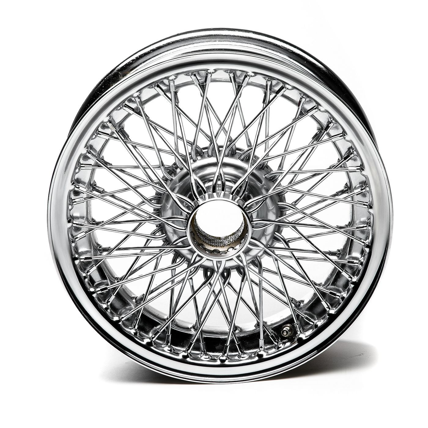 High-polish custom laced wheel for Triumph dual-purpose motorcycles, built for rugged terrain and visual impact.