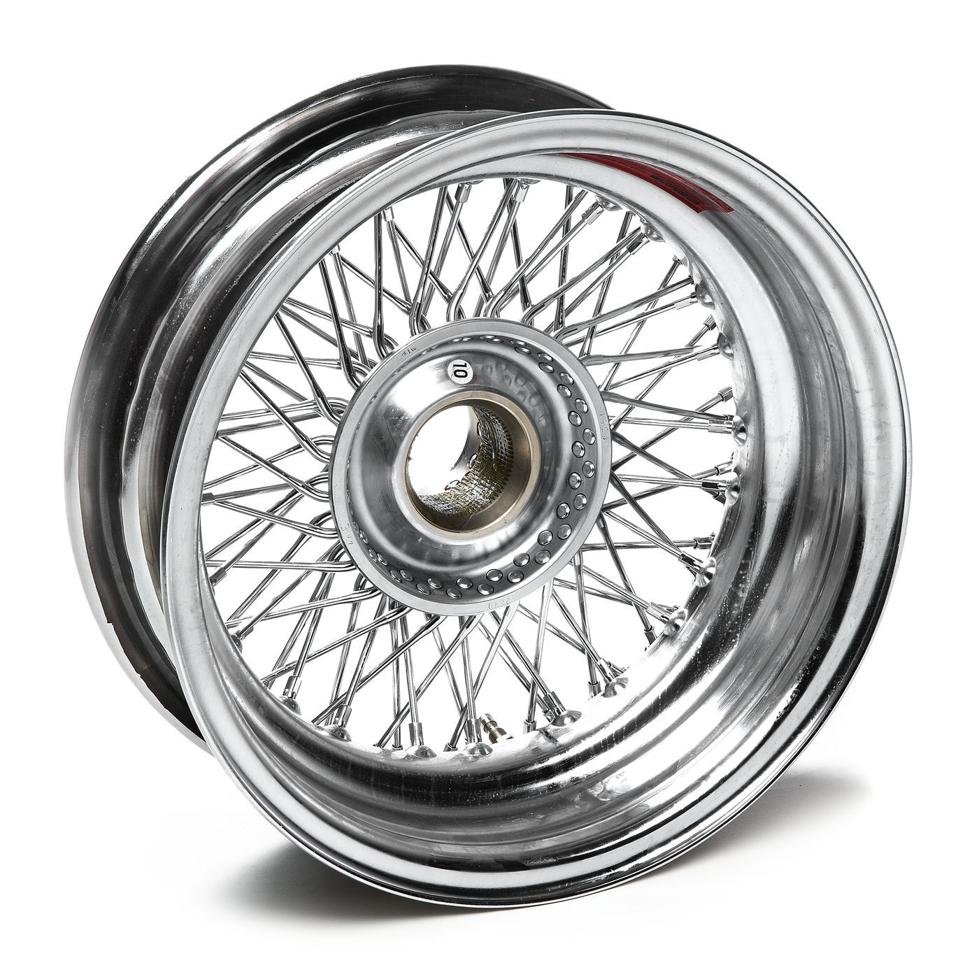 Chrome-finished laced wheel for Triumph Tiger or Scrambler, featuring double-cross spoke design and polished rim.