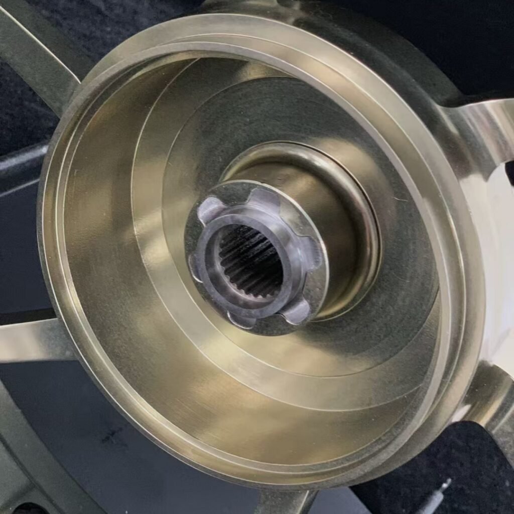 CNC hub with pre-installed bearing and black valve stem on Yamaha NVX155 front wheel