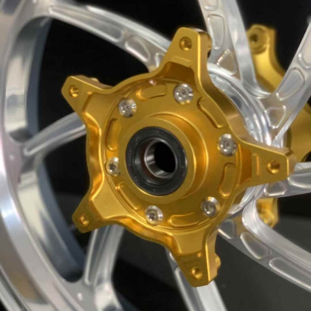 Five-bolt pattern gold flange mounted to forged aluminum rear wheel