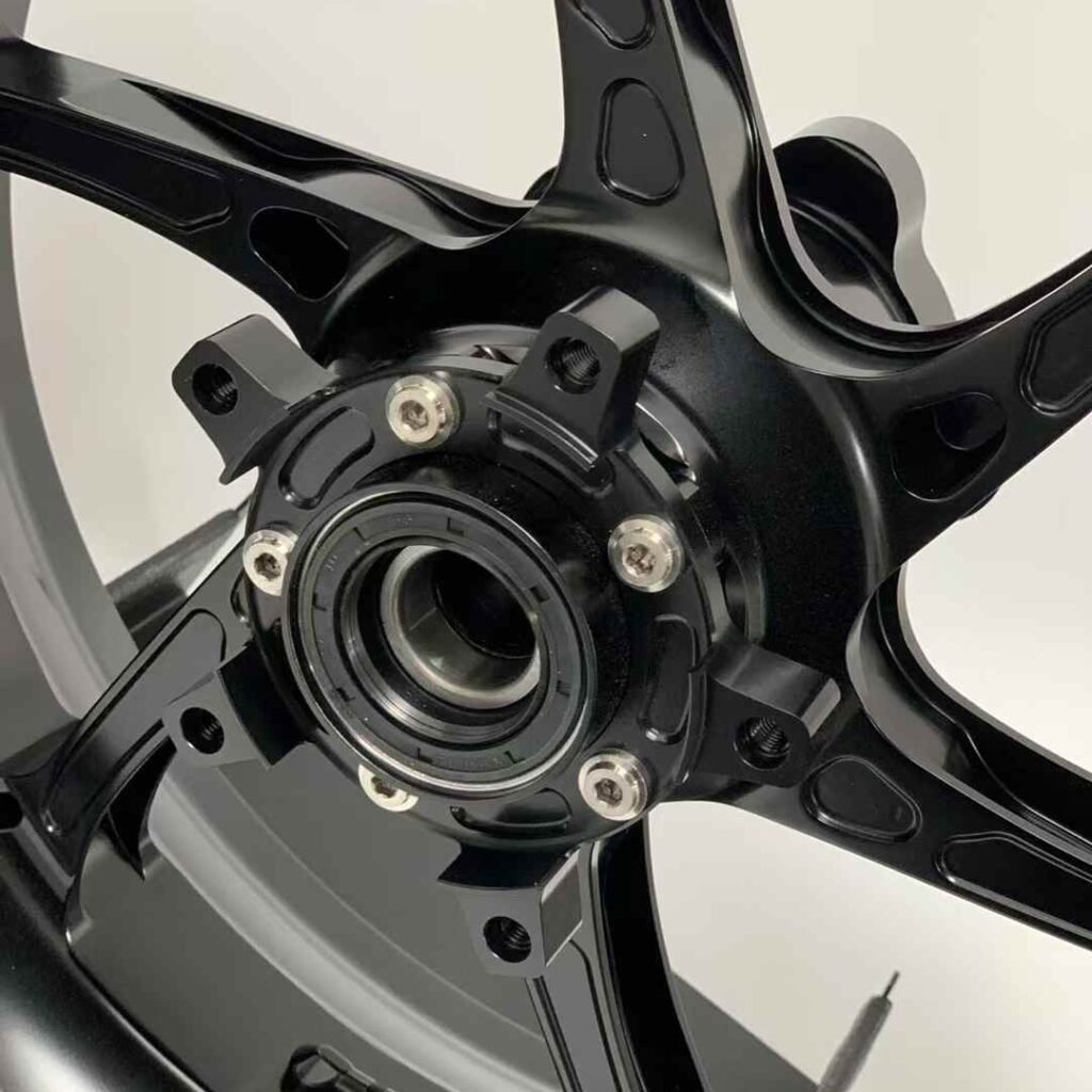 Precision bearing hub interface on front forged wheel for Yamaha R6