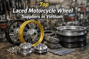 Laced motorcycle wheels and spoke wheel components displayed in a Vietnam motorcycle parts workshop