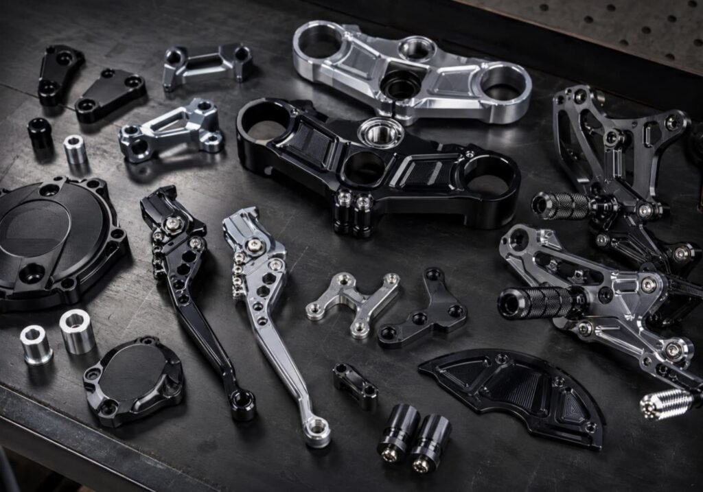 CNC-machined billet motorcycle parts — triple clamp and levers, FLEXIMOTO
