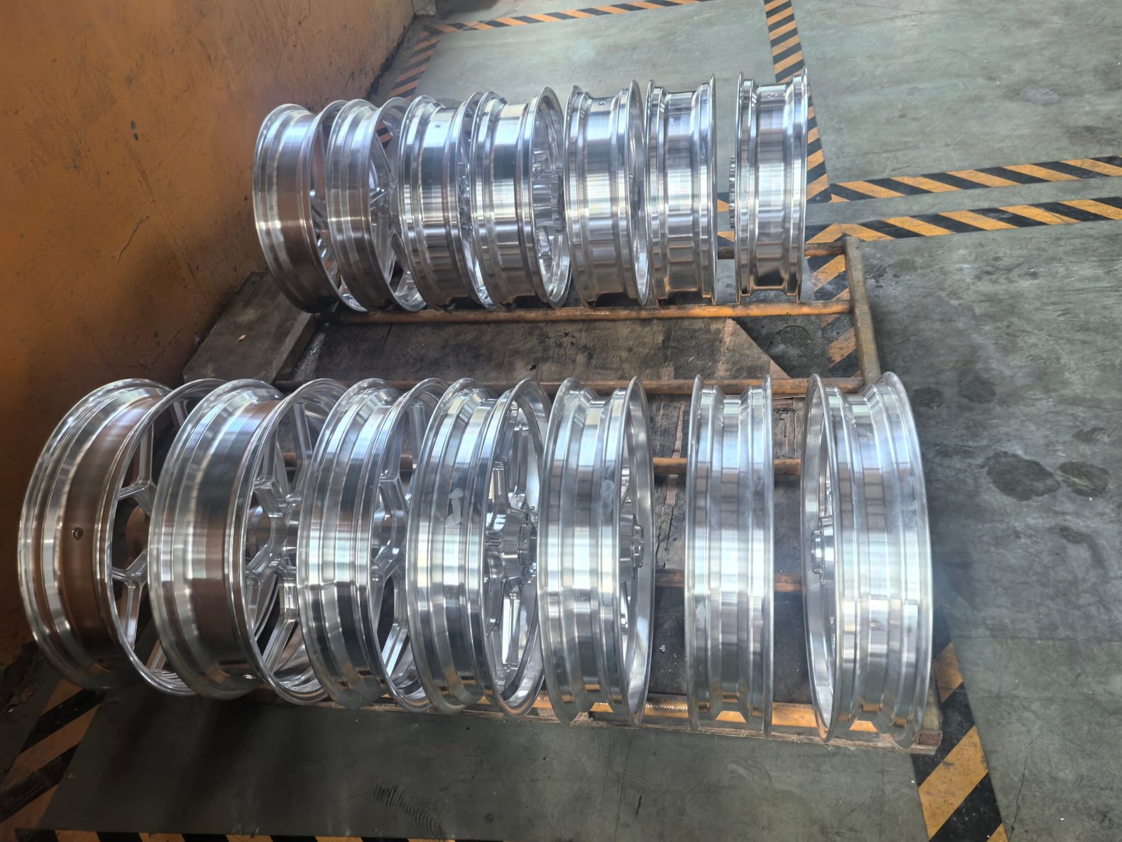 Machined AZ80 forged magnesium motorcycle wheels on pallets awaiting finishing, supplied by FLEXIMOTO