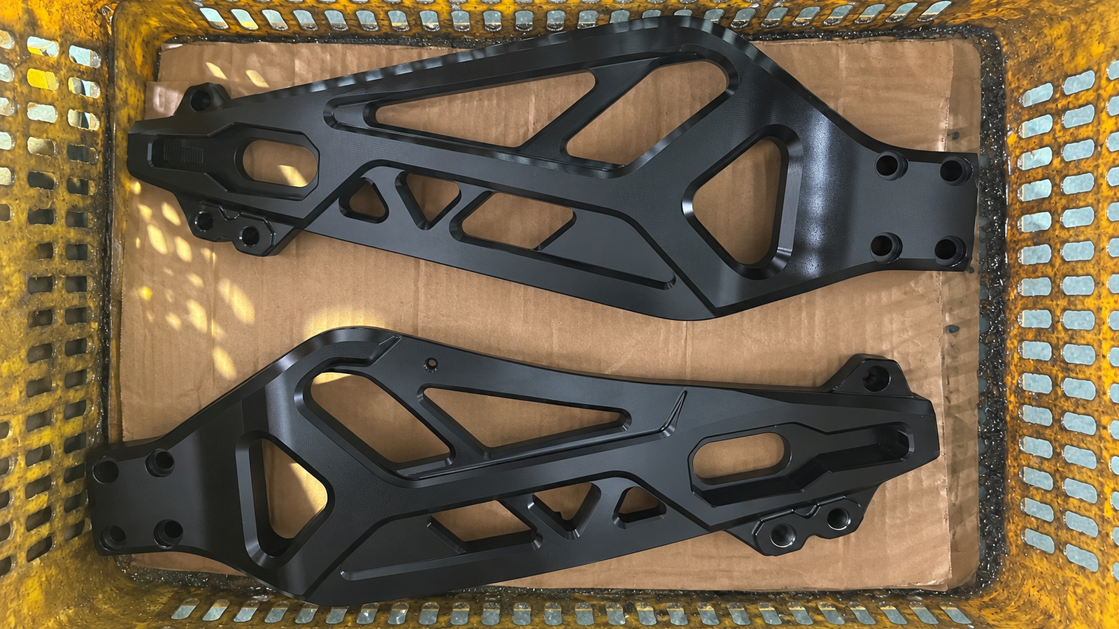 Black anodized CNC-machined 6061-T6 motorcycle swingarm arms, FLEXIMOTO