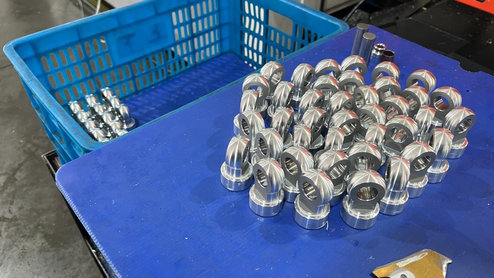 CNC-machined aluminum motorcycle shock absorber eyelets fresh off the machine